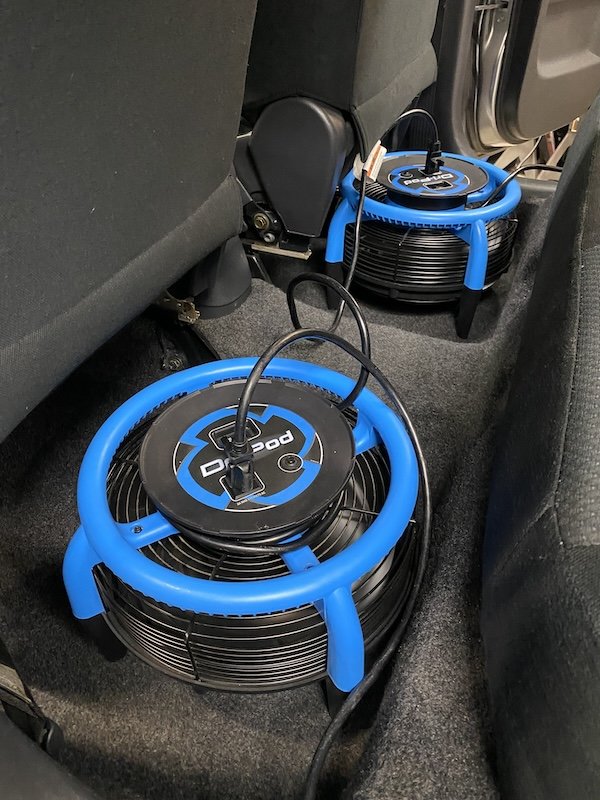 car interior carpet being dried with fans